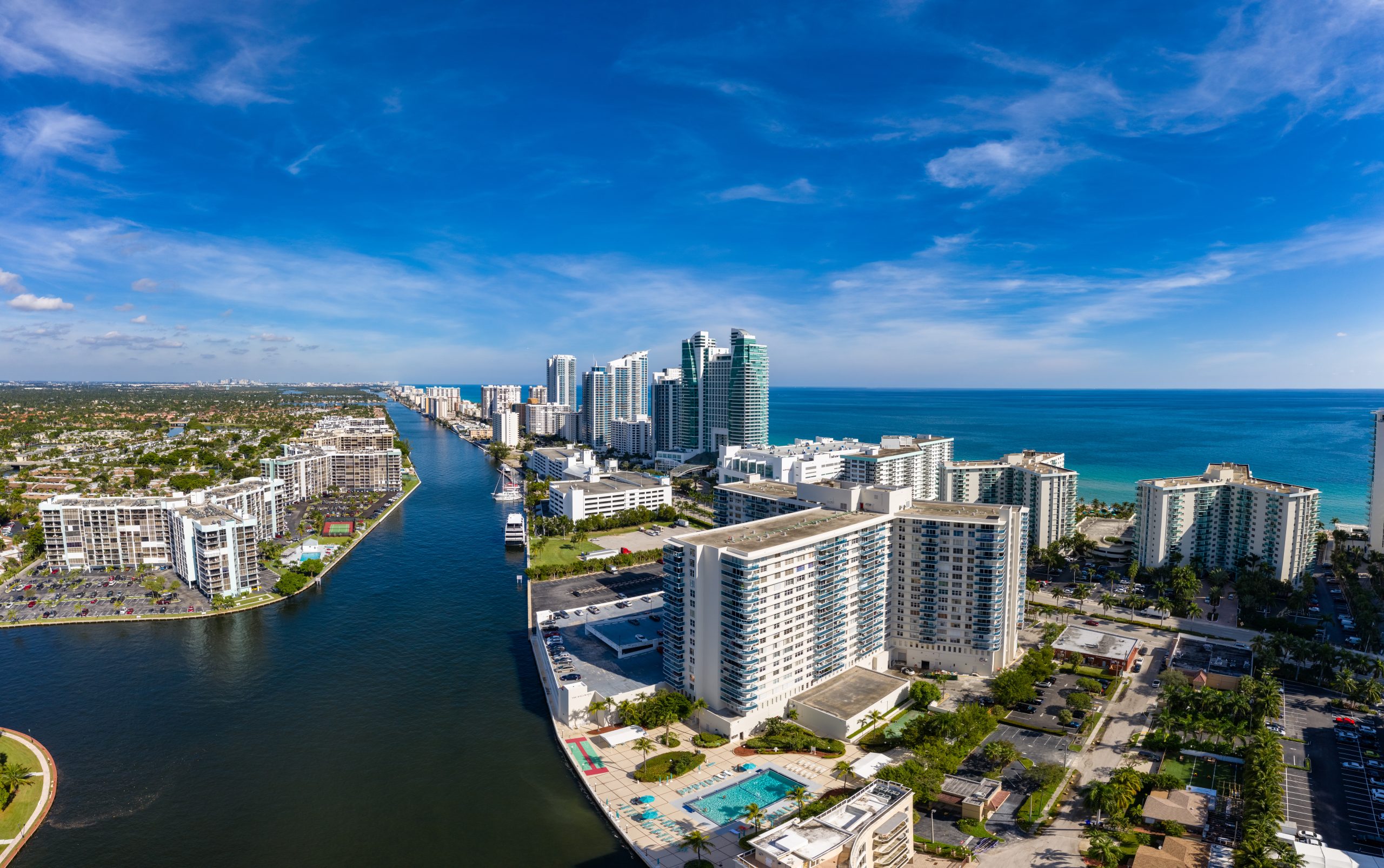 Scenic view of a city skyline with waterfront buildings.